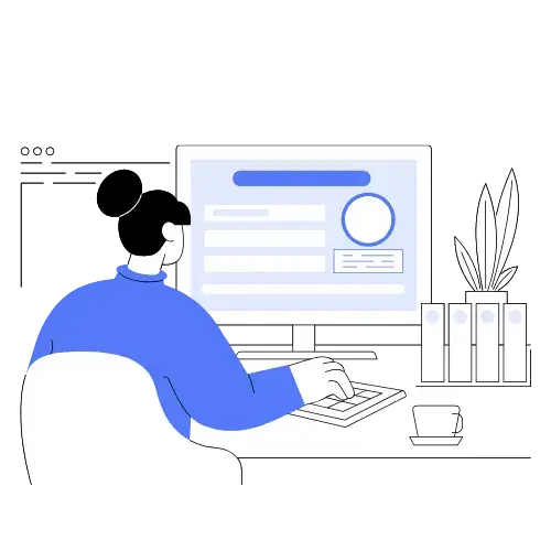 Incorporate Your Business in New Zealand 5 A person focused on their work, typing on a computer in front of a large monitor in a well-lit office environment.